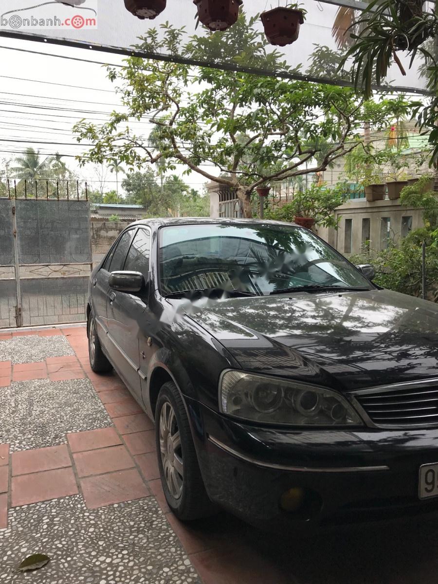 Ford Laser GHIA 1.8 AT 2003 - Bán Ford Laser GHIA 1.8 AT năm sản xuất 2003, màu đen số tự động, giá tốt