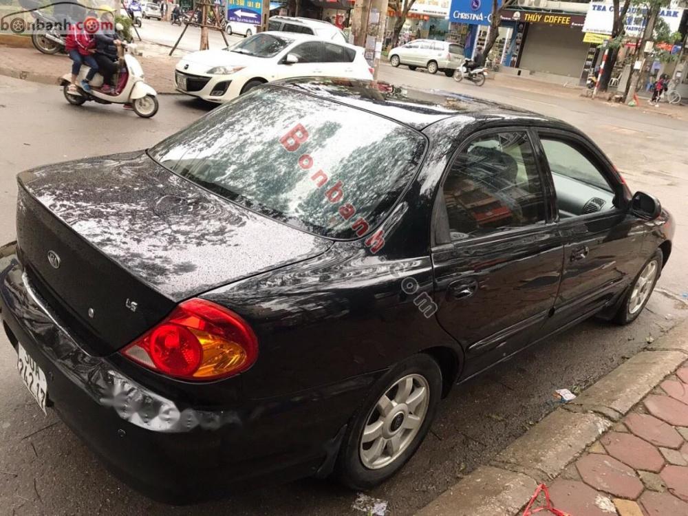 Kia Spectra LS 2004 - Bán Kia Spectra LS sản xuất 2004, màu đen xe gia đình, giá tốt