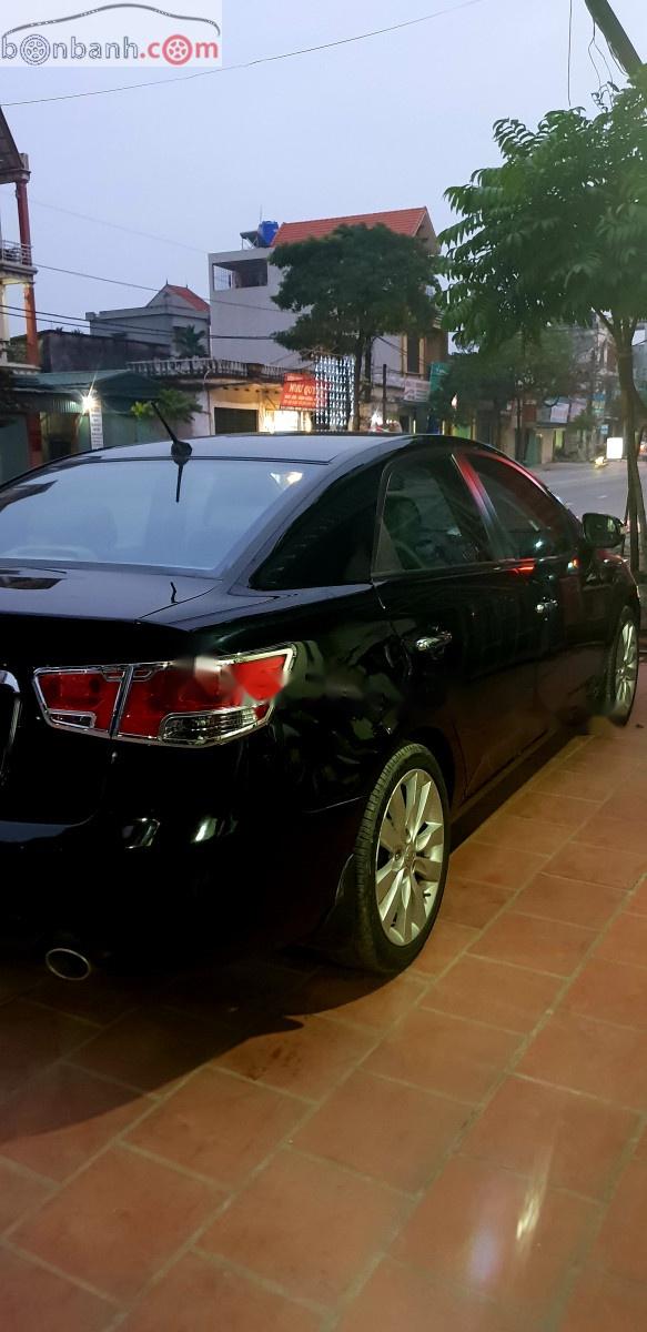 Kia Cerato 1.6  2009 - Bán ô tô Kia Cerato 1.6 sản xuất 2009, màu đen, xe nhập, số tự động