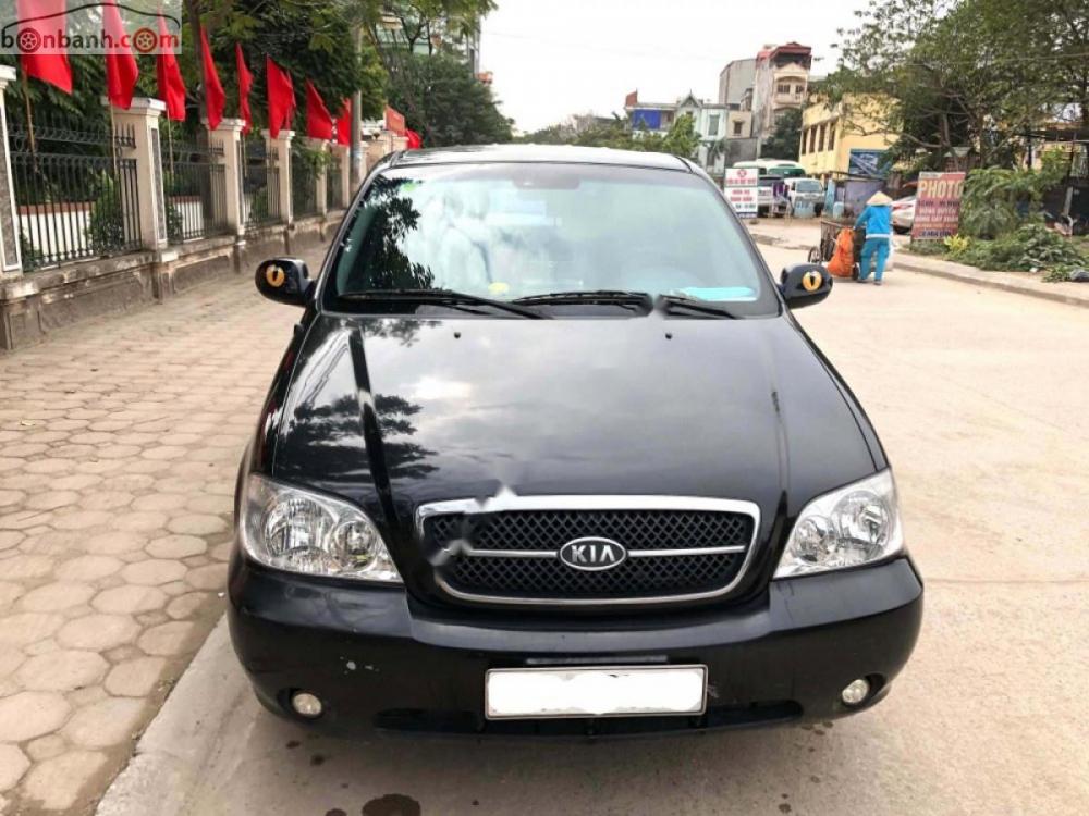 Kia Carnival GS 2.5 AT 2009 - Cần bán xe Kia Carnival GS 2.5 AT sản xuất năm 2009, màu đen chính chủ