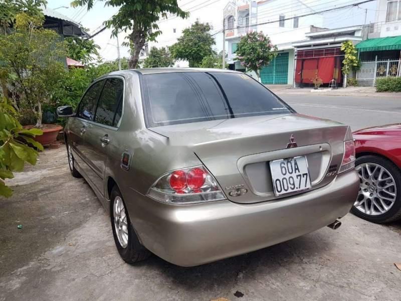 Mitsubishi Lancer GLX 1.6  2003 - Cần bán xe Mitsubishi Lancer GLX 1.6 sản xuất 2003, màu vàng, xe nhập, giá 215tr