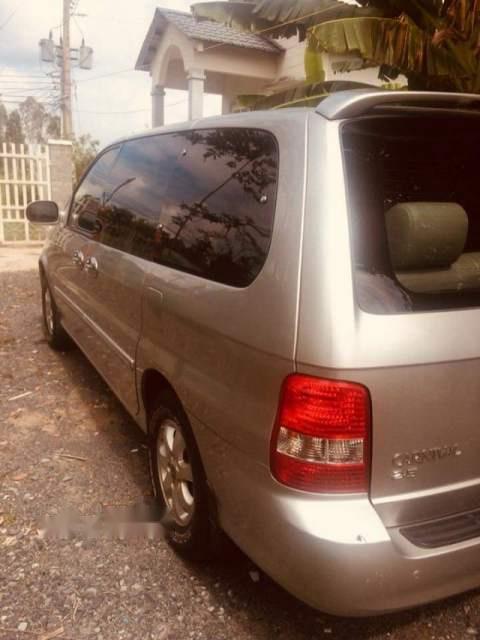 Kia Carnival 2005 - Bán ô tô Kia Carnival năm 2005, màu bạc, nhập khẩu xe gia đình