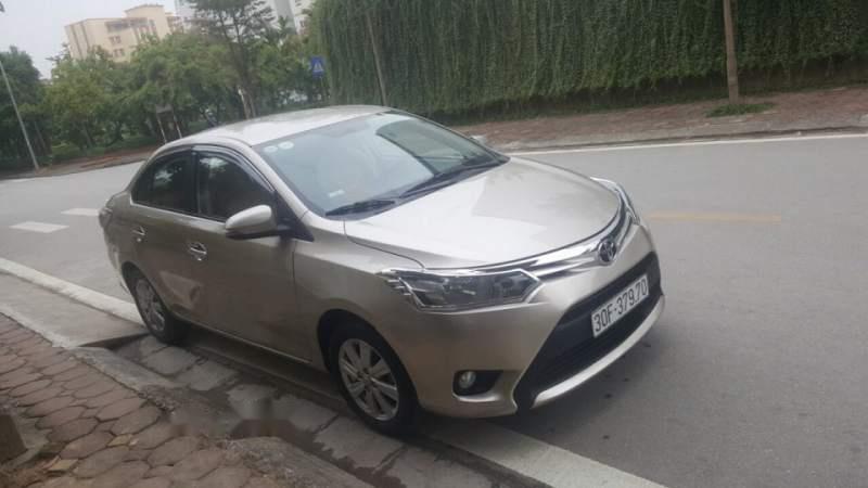 Toyota Vios E 2015 - Chính chủ bán xe Toyota Vios E sản xuất 2015, màu vàng cát