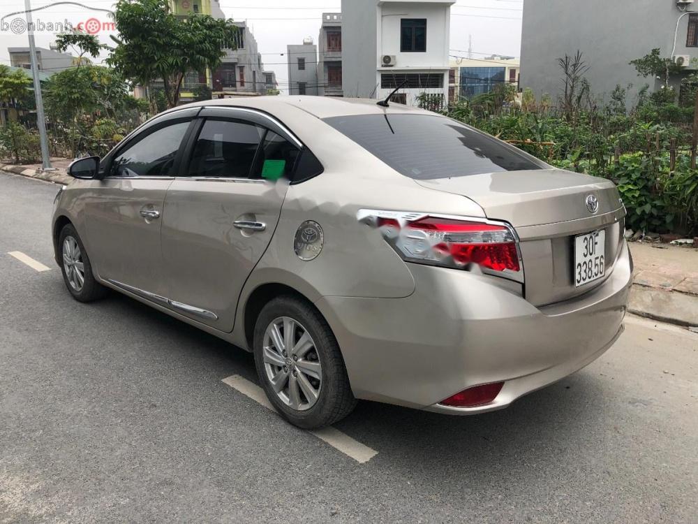 Toyota Vios 1.5 E 2015 - Bán xe Toyota Vios 1.5 E 2015, màu vàng, giá chỉ 420 triệu