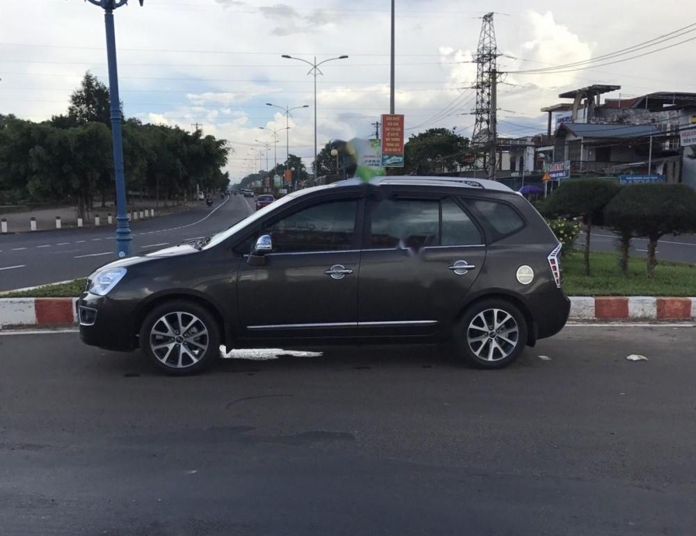 Kia Carens S SX 2.0 MT 2014 - Gia đình cần bán Kia Carens S 2.0 màu nâu, số sàn, sx năm 2014