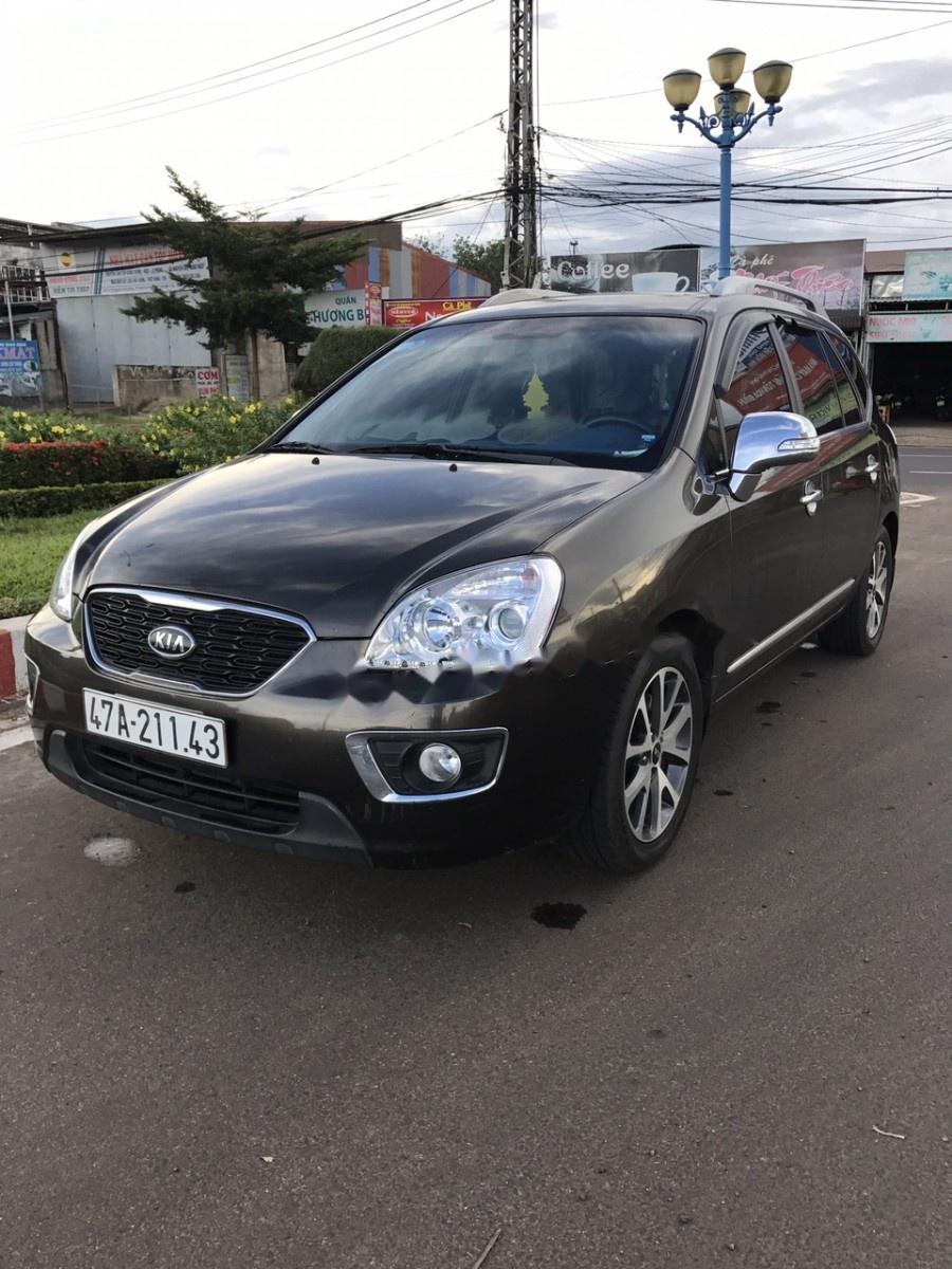 Kia Carens S SX 2.0 MT 2014 - Gia đình cần bán Kia Carens S 2.0 màu nâu, số sàn, sx năm 2014