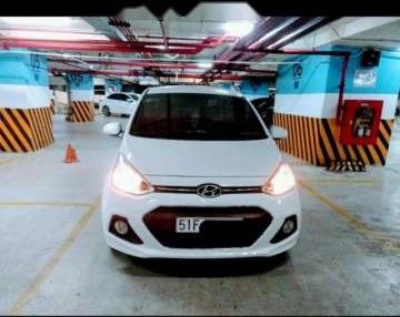 Hyundai Grand i10 AT 2016 - Bán xe Hyundai Grand i10 AT sản xuất năm 2016, màu trắng, xe nhập  