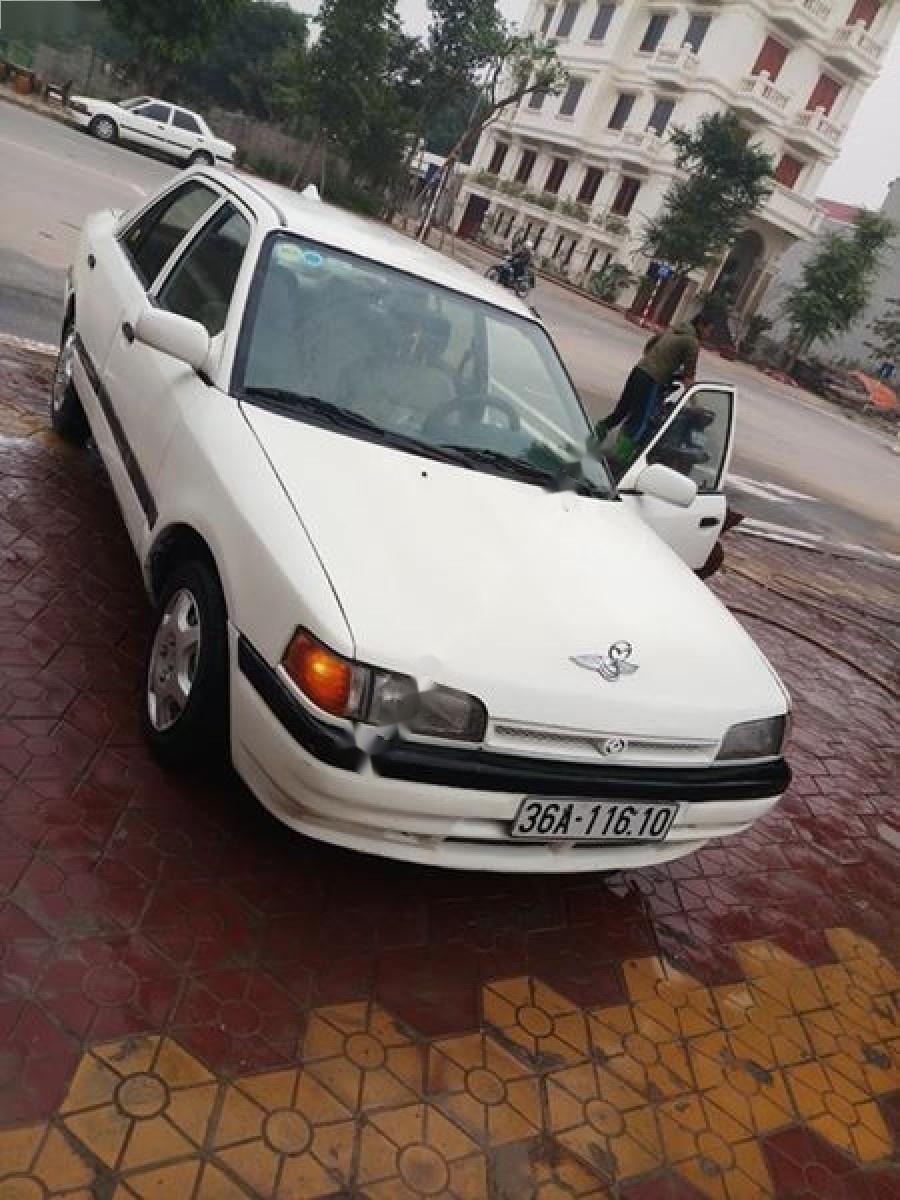 Mazda 323 1.6 MT 1995 - Cần bán Mazda 323 1.6 MT 1995, màu trắng