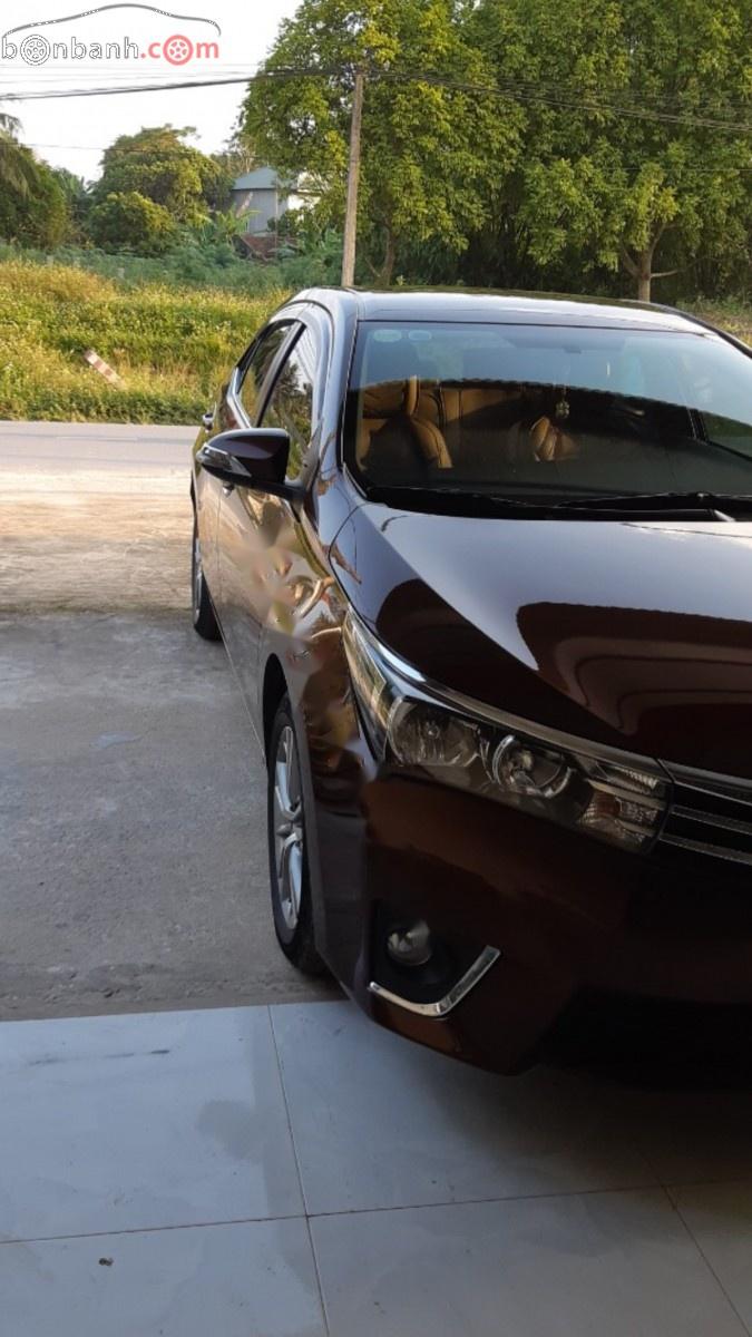 Toyota Corolla altis 1.8G MT 2015 - Bán Toyota Corolla altis 1.8G MT đời 2015, màu nâu, đẹp như mới