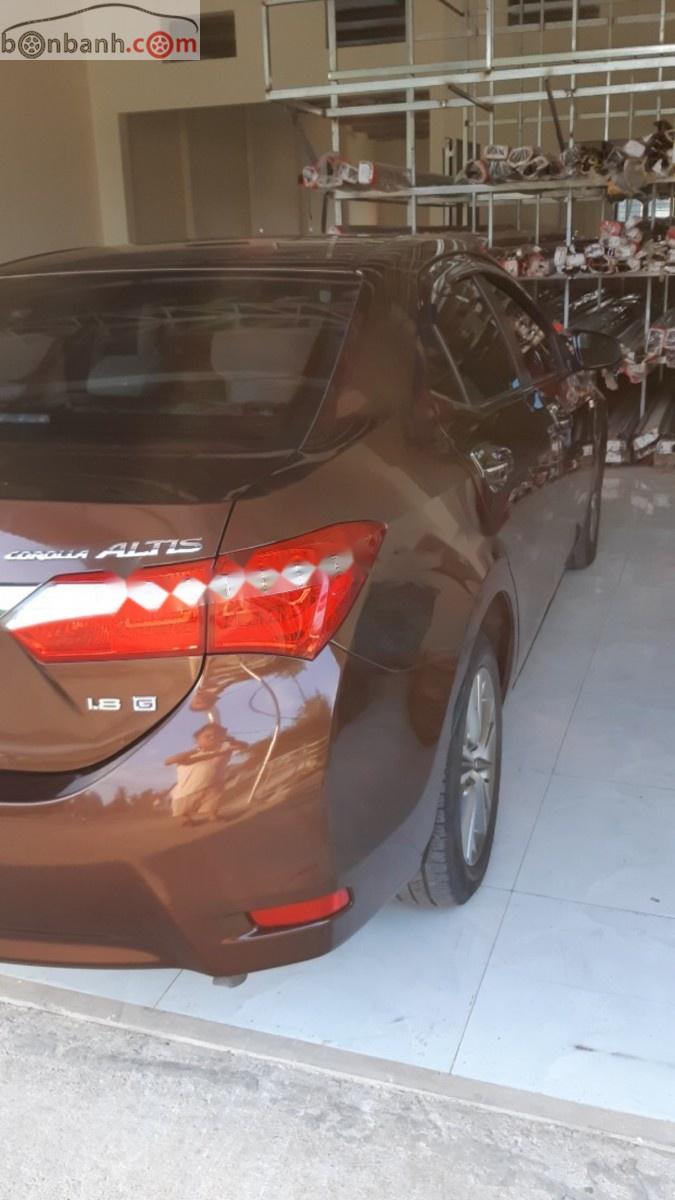 Toyota Corolla altis 1.8G MT 2015 - Bán Toyota Corolla altis 1.8G MT đời 2015, màu nâu, đẹp như mới