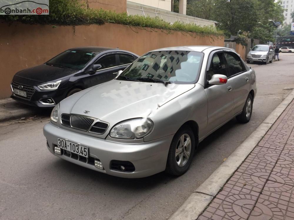 Daewoo Lanos SX 2004 - Cần bán gấp Daewoo Lanos SX 2004, màu bạc