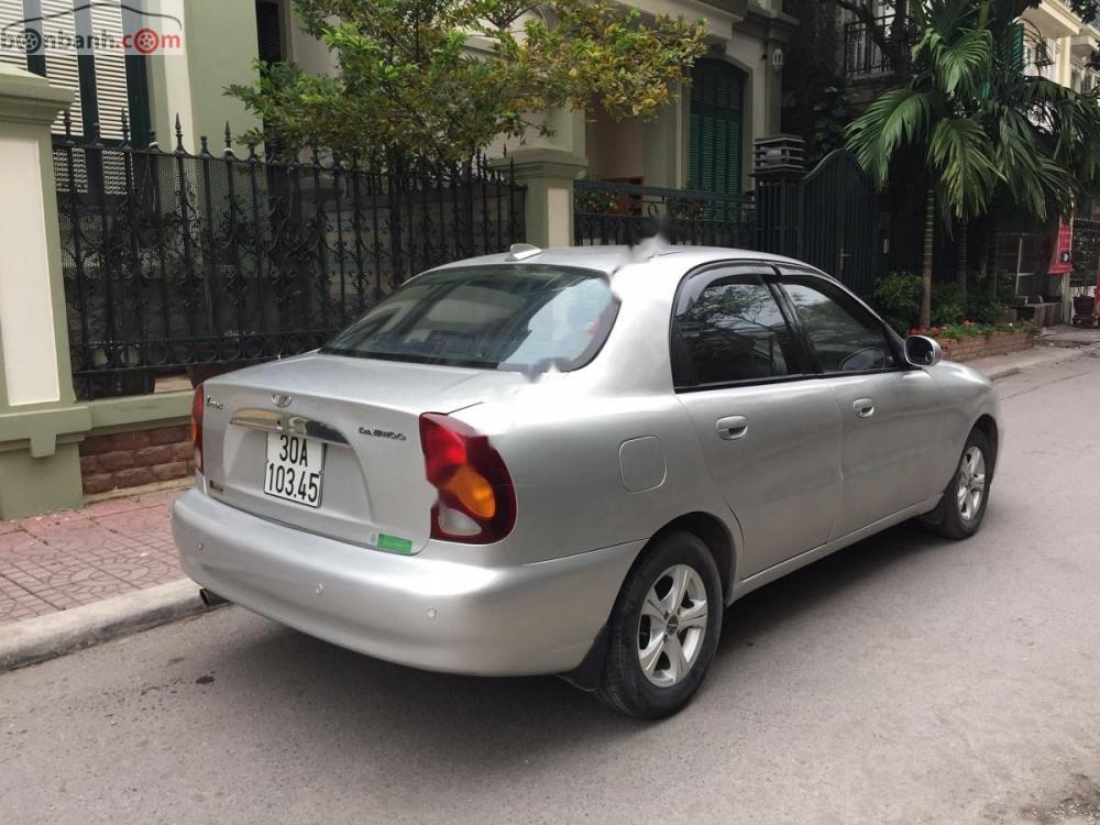 Daewoo Lanos SX 2004 - Cần bán gấp Daewoo Lanos SX 2004, màu bạc