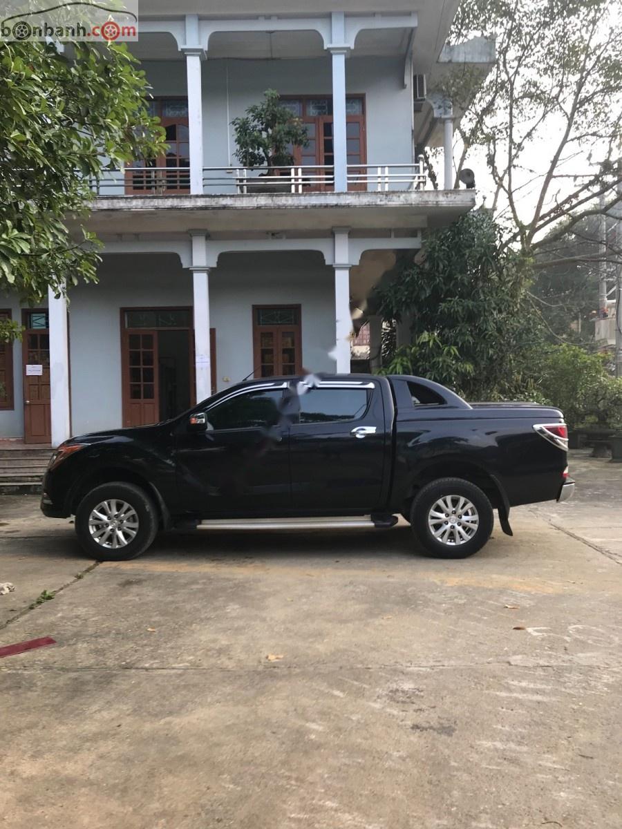 Mazda BT 50 3.2L 4x4 AT 2014 - Gia đình bán xe Mazda BT 50 3.2L 4x4 AT đời 2014, màu đen, nhập khẩu