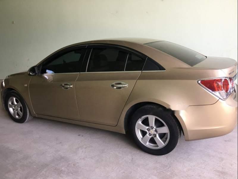 Chevrolet Cruze  MT 2012 - Cần bán gấp Chevrolet Cruze MT đời 2012, màu vàng, nhập khẩu