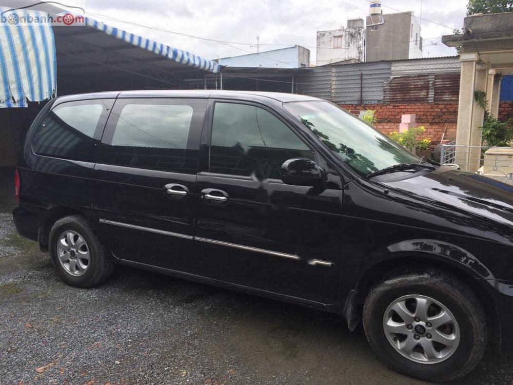 Kia Carnival 2006 - Bán Kia Carnival đời 2006, màu đen, nhập khẩu xe gia đình, giá tốt