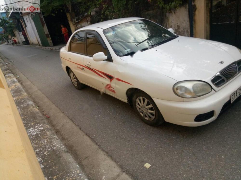 Daewoo Lanos SX 2004 - Gia đình cần bán Daewoo Lanos SX đời 2004, màu trắng, giá 72tr