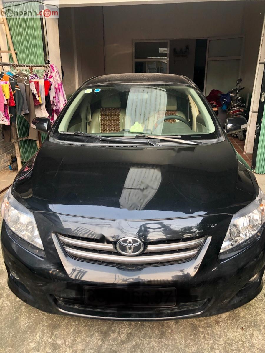 Toyota Corolla altis 1.8G MT 2009 - Bán xe Toyota Corolla Altis 1.8G sx 2009, số tay, máy xăng, màu đen, nội thất màu kem, đã đi 154000 km