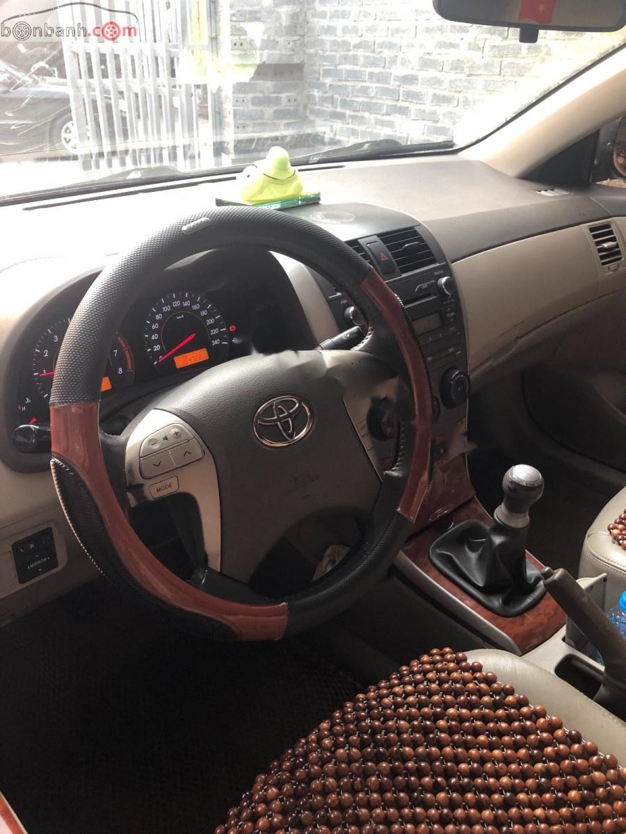 Toyota Corolla altis 1.8G MT 2009 - Bán xe Toyota Corolla Altis 1.8G sx 2009, số tay, máy xăng, màu đen, nội thất màu kem, đã đi 154000 km