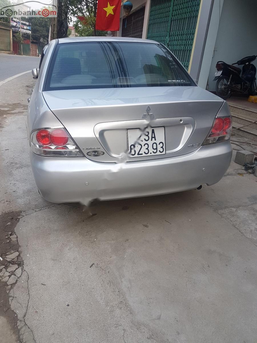 Mitsubishi Lancer 2004 - Cần bán xe Mitsubishi Lancer đời 2004, màu bạc, xe đi ít giữ gìn cẩn thận