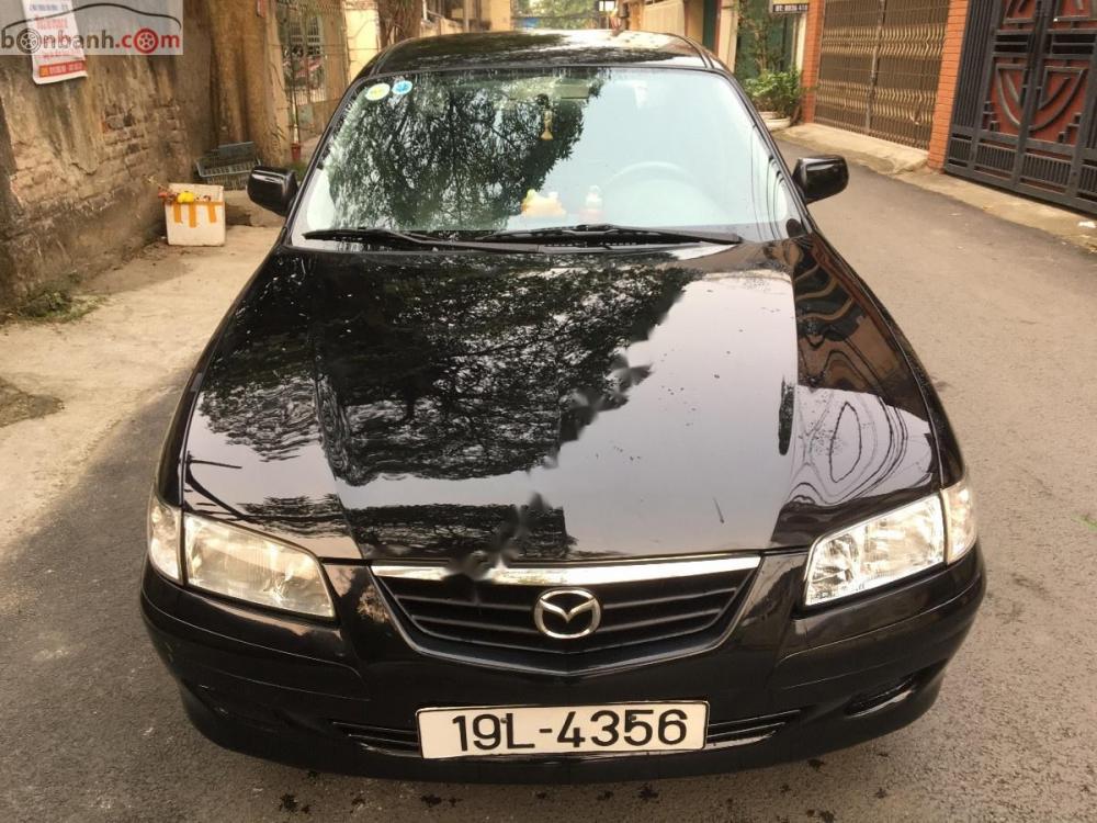 Mazda 626 2.0 MT 2003 - Bán Mazda 626 bản đủ nhất sx 2003, số tay, máy xăng, màu đen, hai túi khí phanh ABS