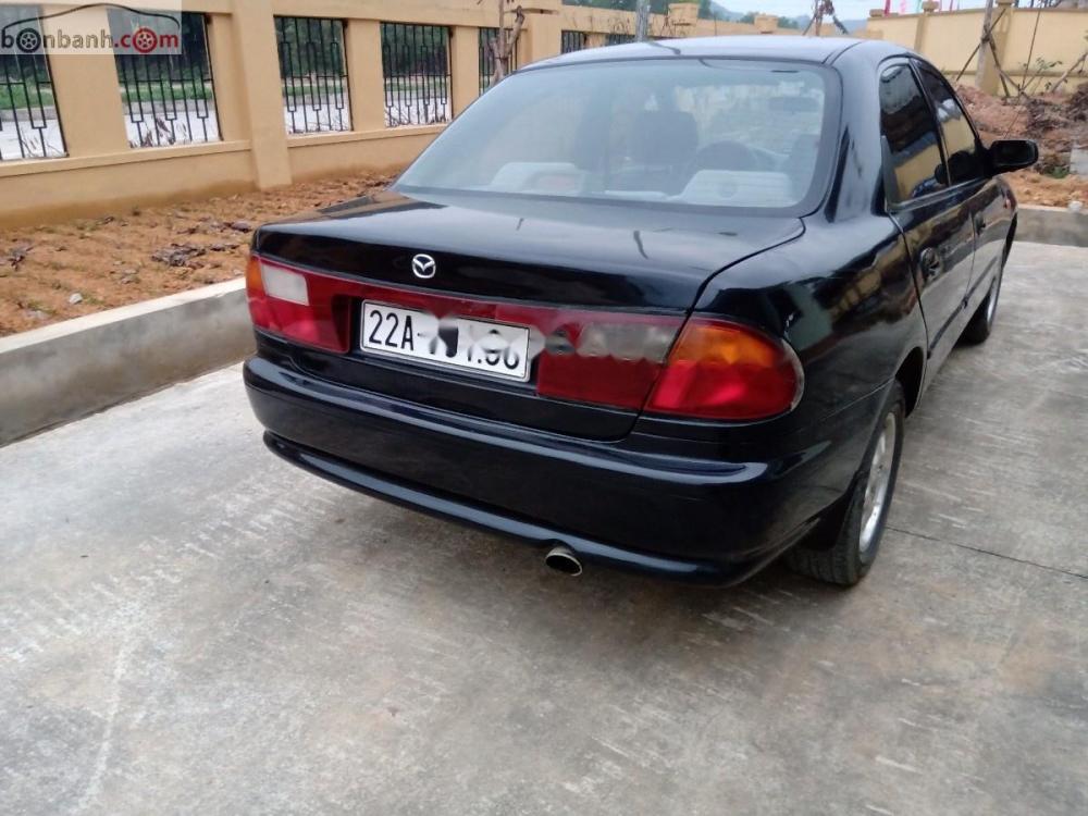 Mazda 323 GLXi 1.6 MT 2000 - Bán Mazda 323 2000, còn tương đối nguyên bản