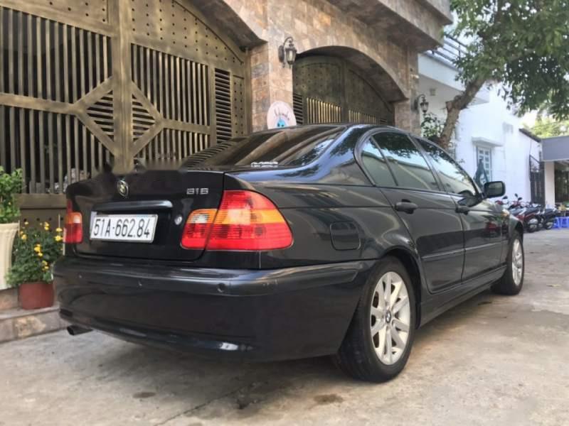 BMW 3 Series  318i   2004 - Cần bán BMW 318i sản xuất 2004, màu đen, số tự động