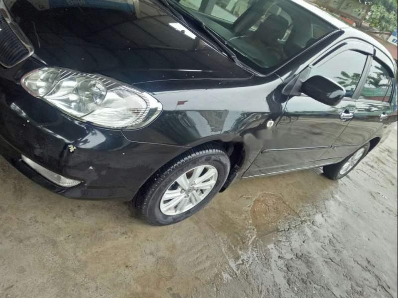 Toyota Corolla altis  1.8MT 2004 - Bán Toyota Corolla altis 1.8MT đời 2004, màu đen