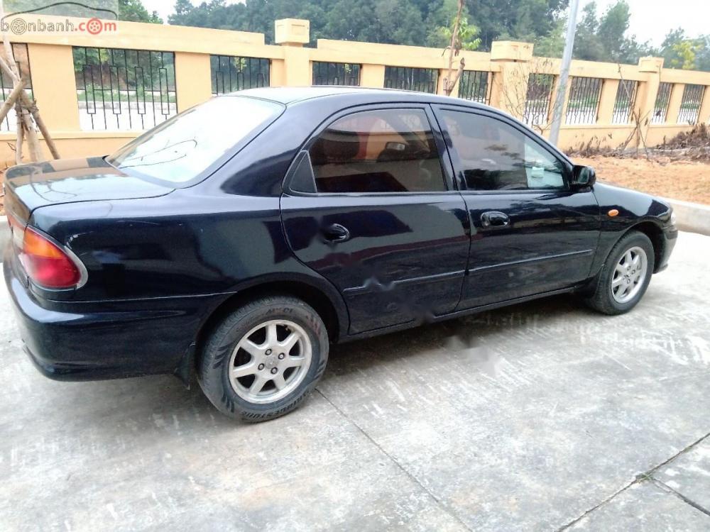 Mazda 323 2000 - Bán Mazda 323 2000, còn tương đối nguyên bản, màu xanh đen quyền lực