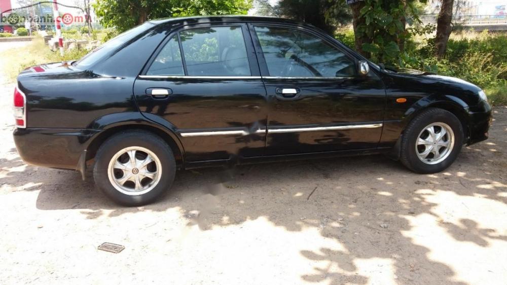 Mazda 323  1.6 L 2004 - Bán xe Mazda 323 1.6 L đời 2004, màu đen, xe công chức đi làm