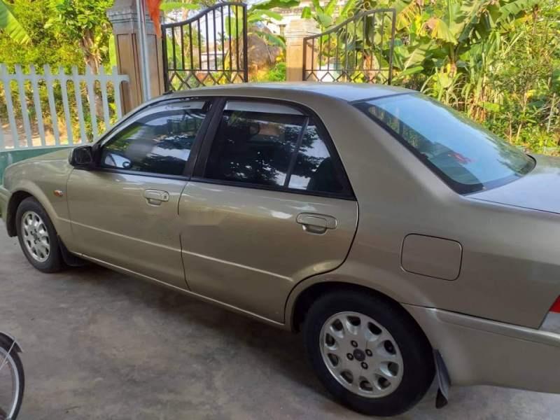 Ford Laser 2000 - Cần bán gấp Ford Laser đời 2000, màu vàng, nhập khẩu, 150tr