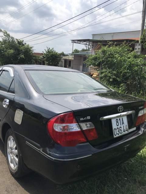 Toyota Camry   2004 - Bán Toyota Camry năm 2004, màu đen số sàn, giá 299tr