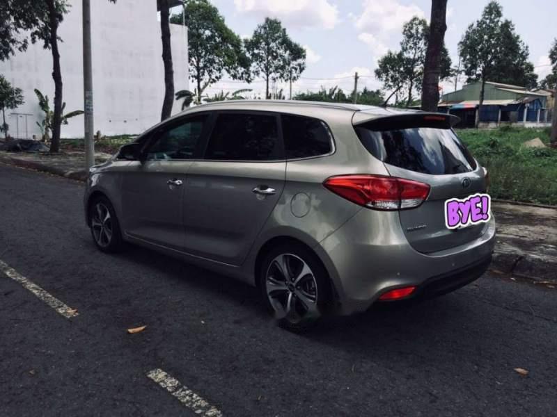 Kia Rondo 2016 - Bán ô tô Kia Rondo sản xuất 2016, màu vàng cát