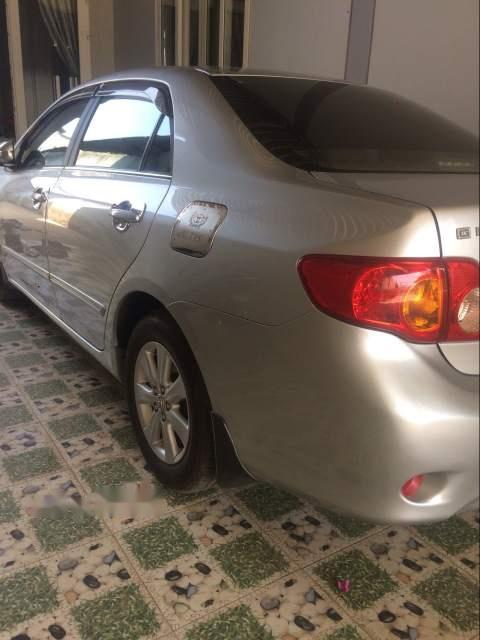 Toyota Corolla altis 2009 - Cần bán gấp Toyota Corolla altis đời 2009, màu bạc như mới