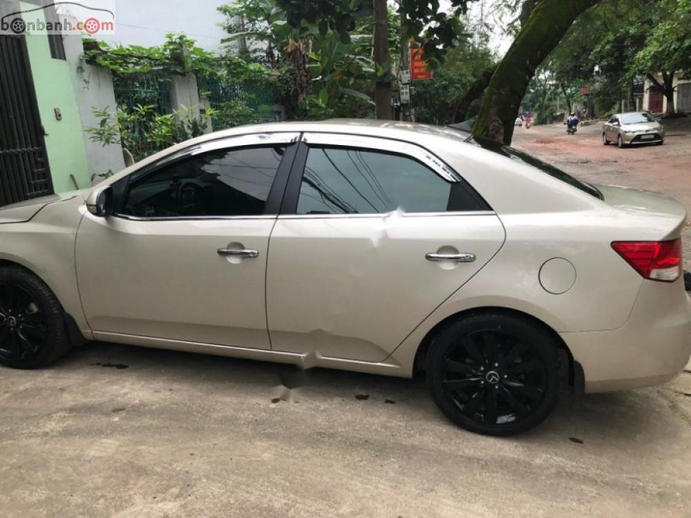 Kia Forte 1.6 AT 2012 - Bán xe Kia Forte 1.6 AT năm 2012, màu vàng cát