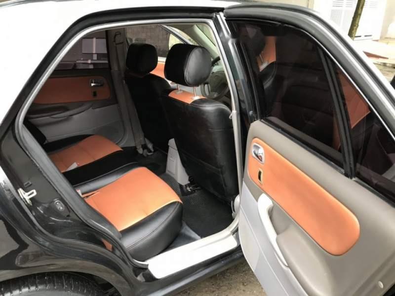 Mazda 626 2004 - Bán xe Mazda 626 đời 2004, màu đen, còn rất chất