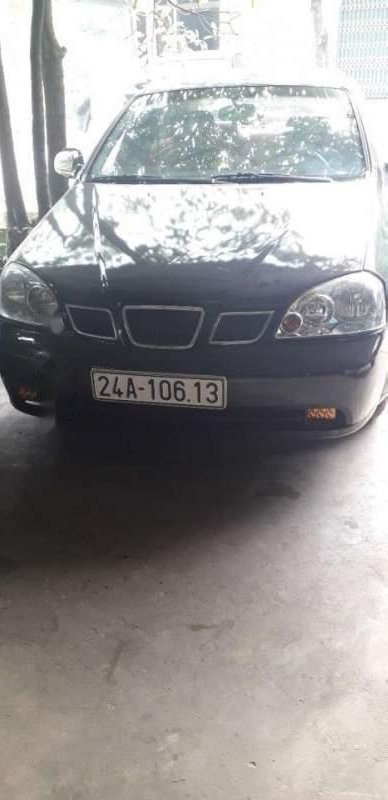 Daewoo Lacetti  MT 2004 - Bán Daewoo Lacetti MT năm sản xuất 2004, màu đen, máy 1.6 ít xăng