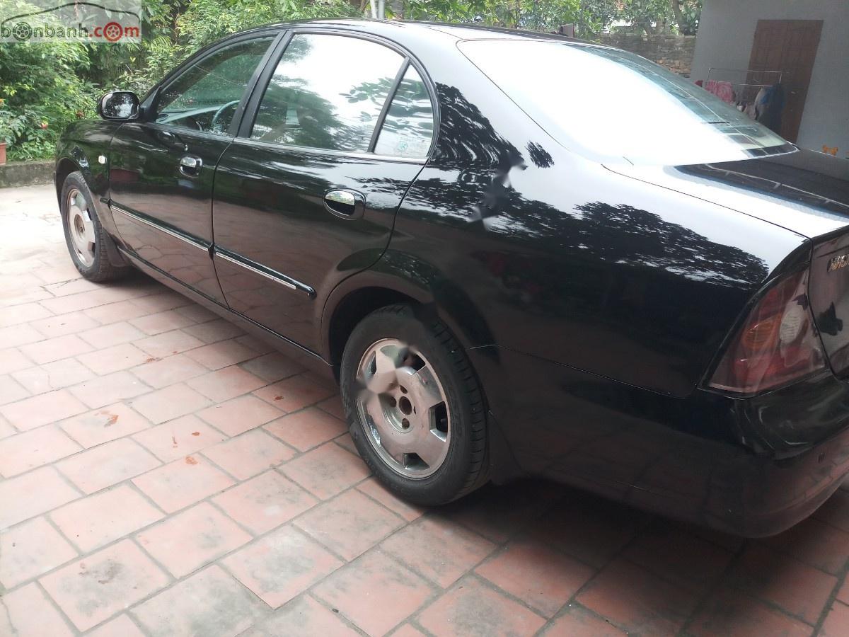 Daewoo Magnus 2004 - Cần bán Daewoo Magnus đời 2004, màu đen, giá 119tr