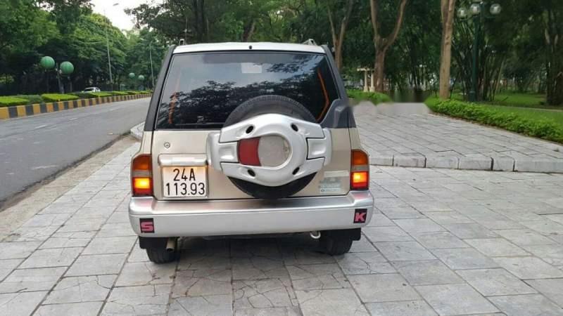 Suzuki Vitara 2004 - Bán Suzuki Vitara sản xuất năm 2004, màu vàng, số sàn 2 cầu