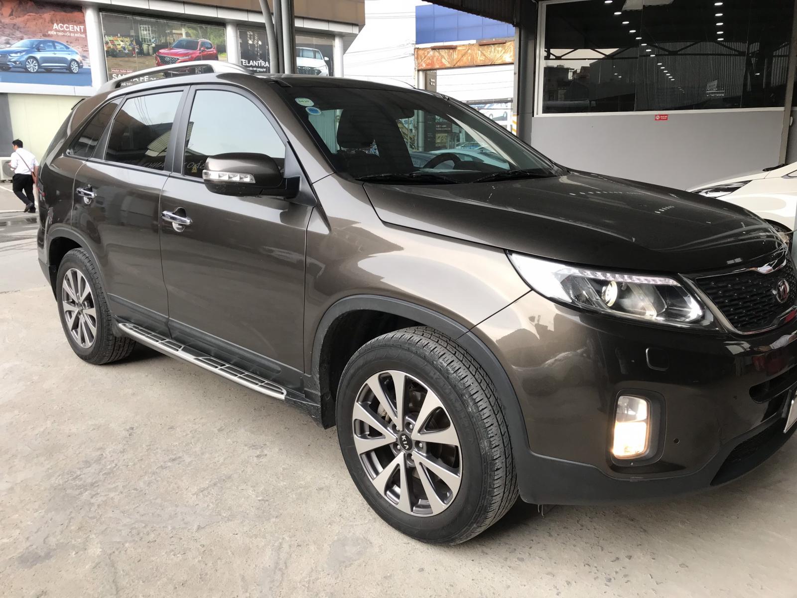 Kia Sorento Si 2.2 CRDi AT 4WD 2014 - Bán Kia New Sorento DATH 2.2AT máy dầu, số tự động, sản xuất 2014, màu nâu titan, biển Sài Gòn 1 chủ