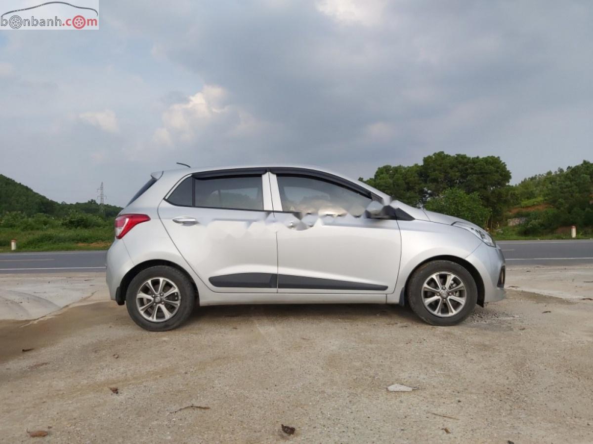 Hyundai Grand i10 1.0AT 2014 - Cần bán Hyundai Grand i10 1.0AT sản xuất 2014, màu bạc, nhập khẩu 