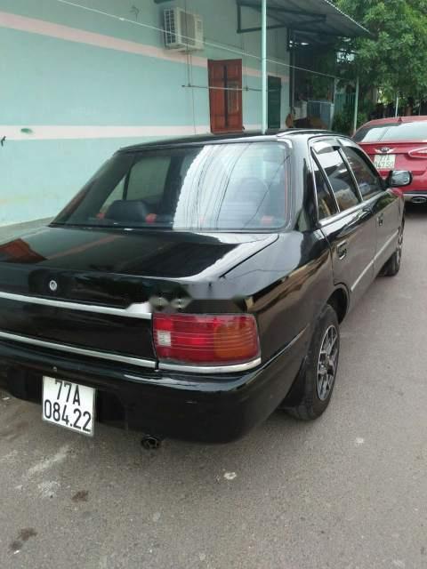 Mazda 323   1995 - Bán xe Mazda 323 đời 1995, màu đen, nhập khẩu