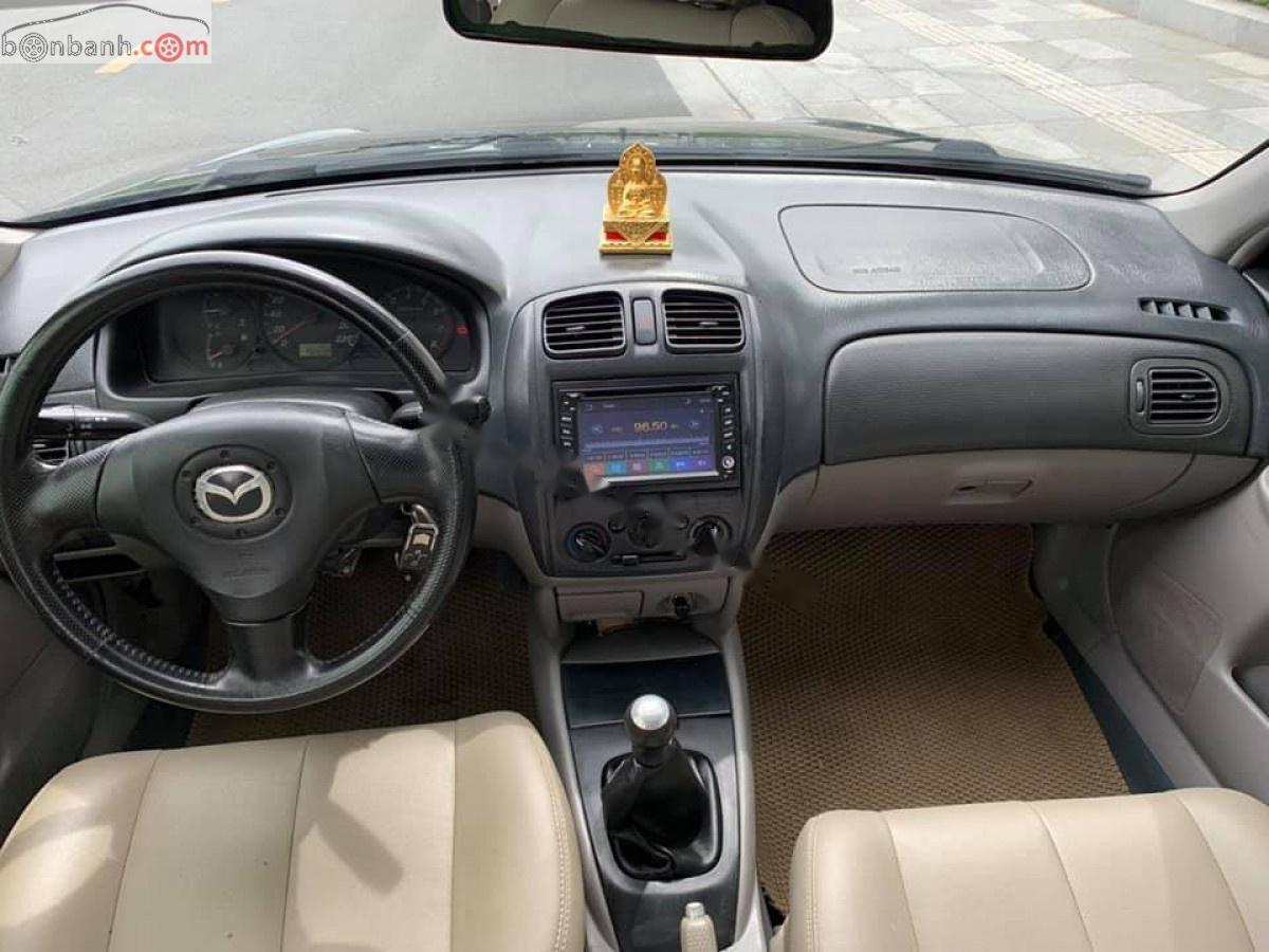 Mazda 323 2003 - Cần bán xe Mazda 323 đời 2003, màu đen, xe đẹp 