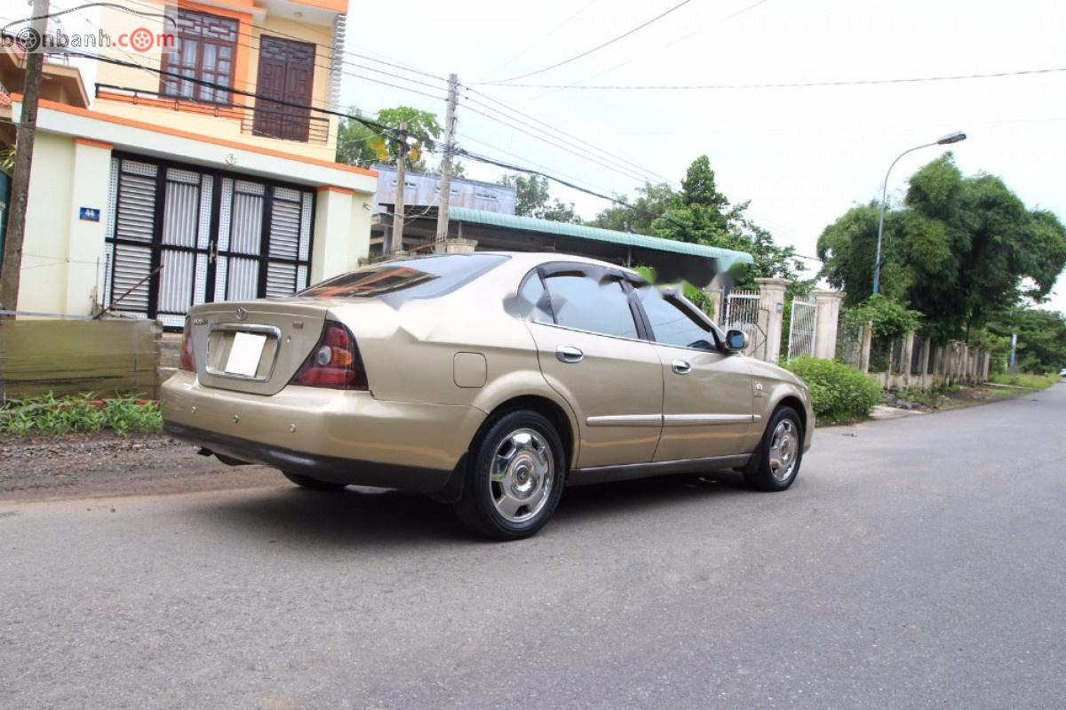 Daewoo Magnus AT 2005 - Bán Daewoo Magnus AT năm 2005, màu vàng số tự động, 148 triệu