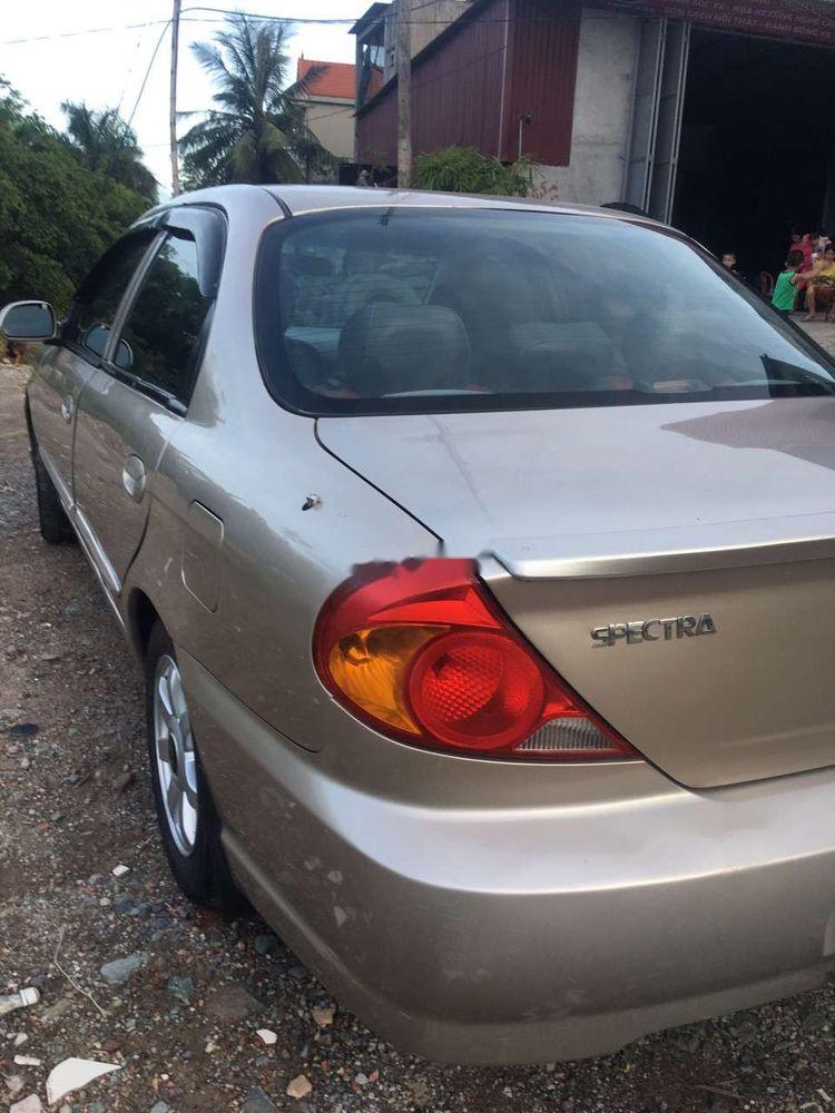 Kia Spectra 2005 - Bán xe Kia Spectra năm sản xuất 2005, màu vàng cát