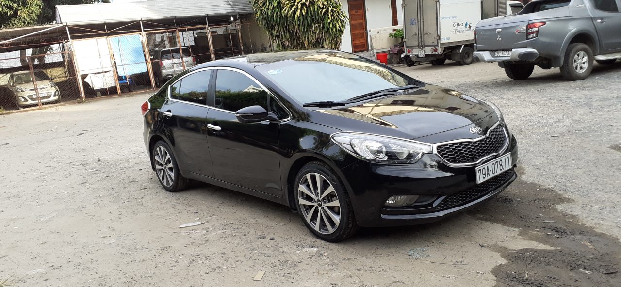 Kia K3   1.6AT 2014 - Nhu cầu đổi xe 7 chỗ nên bán Kia K3 1.6AT 2014