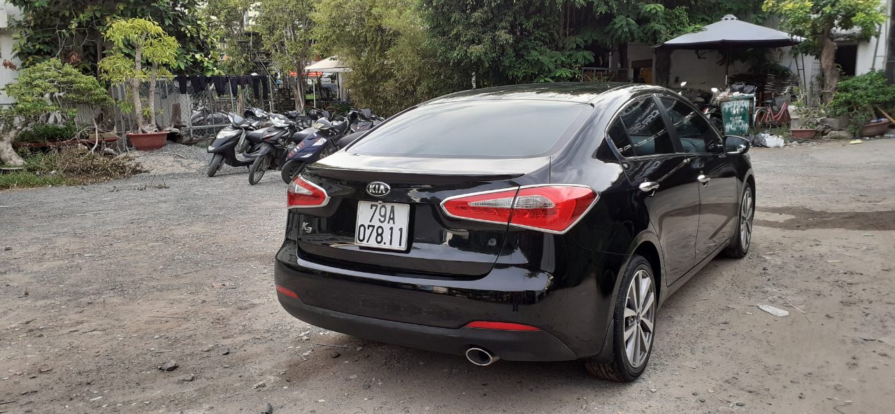 Kia K3 1.6AT 2014 - Nhu cầu đổi xe 7 chỗ nên bán Kia K3 1.6AT 2014