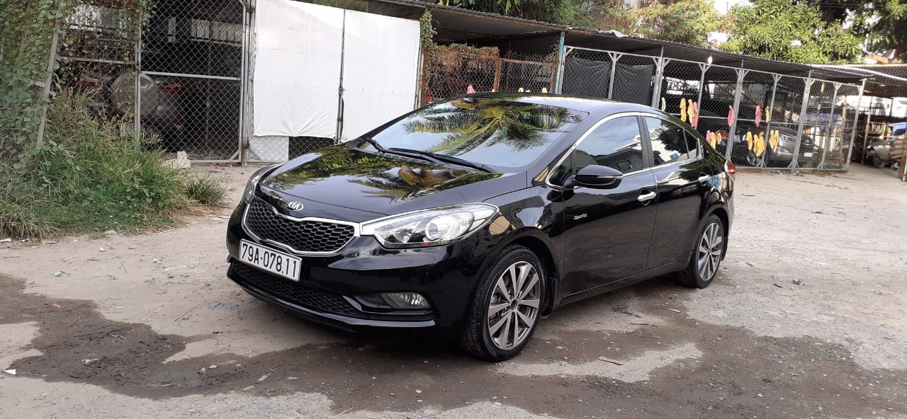 Kia K3   1.6AT 2014 - Nhu cầu đổi xe 7 chỗ nên bán Kia K3 1.6AT 2014