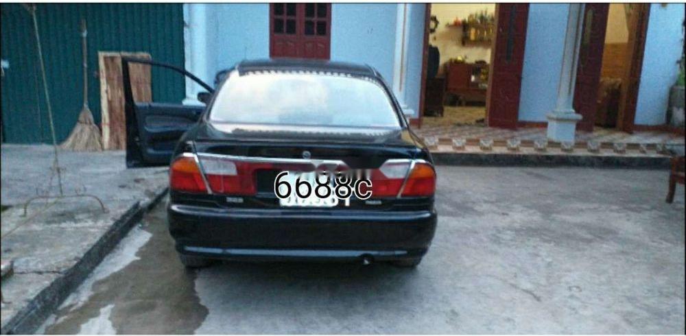 Mazda 323   2000 - Bán Mazda 323 sản xuất năm 2000, màu đen, nhập khẩu 