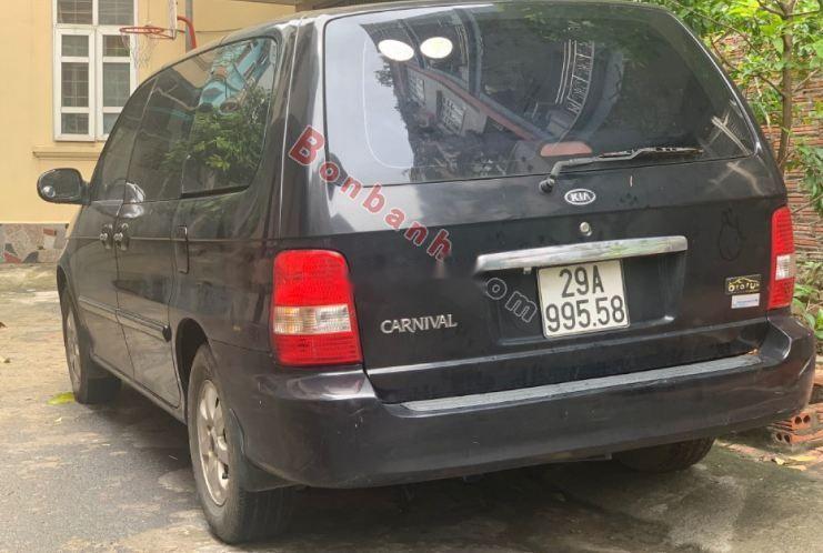 Kia Carnival   2009 - Cần bán Kia Carnival sản xuất năm 2009, màu đen, số tự động