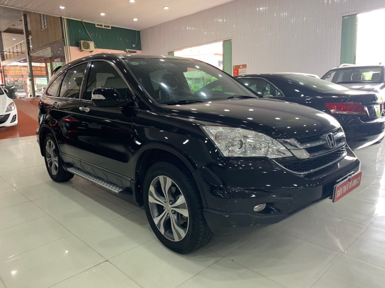 Honda CR V 2012 - Bán xe Honda CR V đăng ký lần đầu 2012, màu đen mới 95%, giá 605 triệu đồng